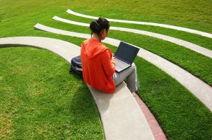 student studying laptop cloud outside