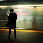 woman reading on subway station