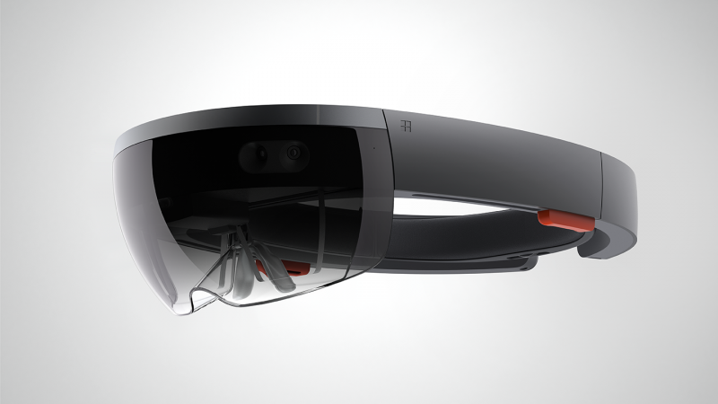 The HoloLens sits on your head by using the inner "ring" to fasten itself and then pivots to sit in the best viewing position in front of your eyes. 