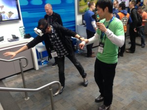 A GDC attendee tries out the headset and reaches for a virtual statue