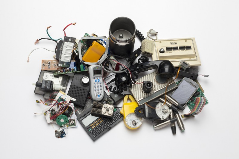 internet of things iot connected devices junk old technology keyboard calculator cell phone keys wires motherboard chip camera lens