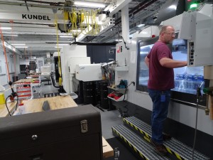 An engineer works on a three-axis milling machine in Facebook's new hardware lab